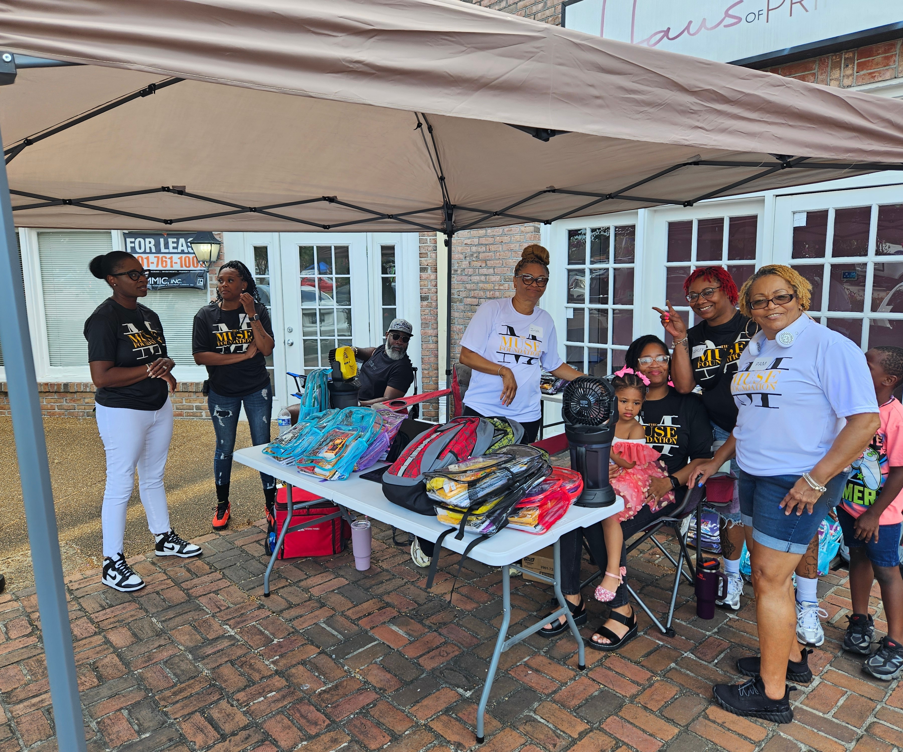 Volunteers coordinating at the backpack giveaway in the mall