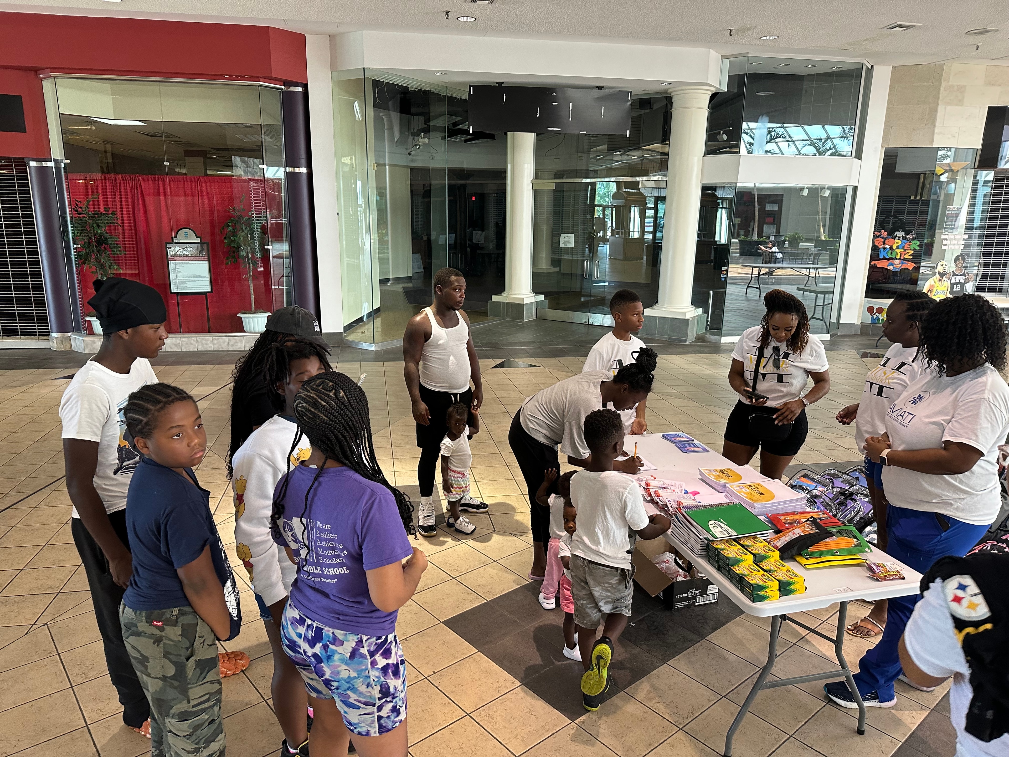 Muse Foundation volunteers setting up school supply distribution